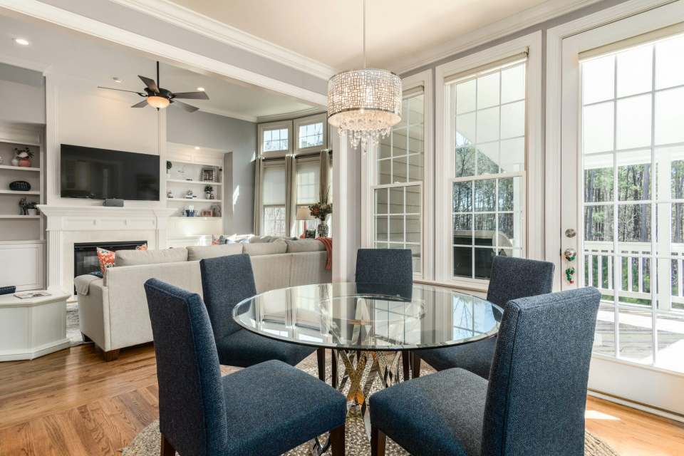 Cozy dining and living room area with natural light.